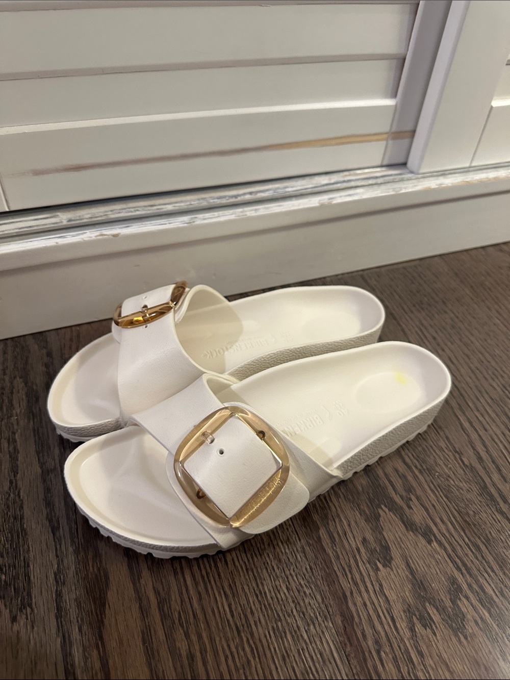 Birkenstock White Slide Sandals with Gold Buckles